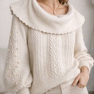 Neutral toned cable knit sweater, pearl embellished sleeves